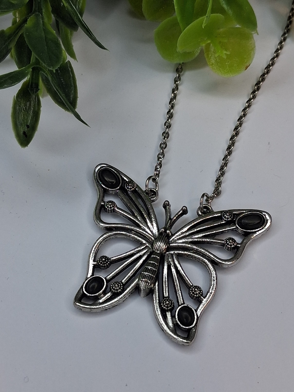Silver Butterfly Pendant Necklace With Black Accents